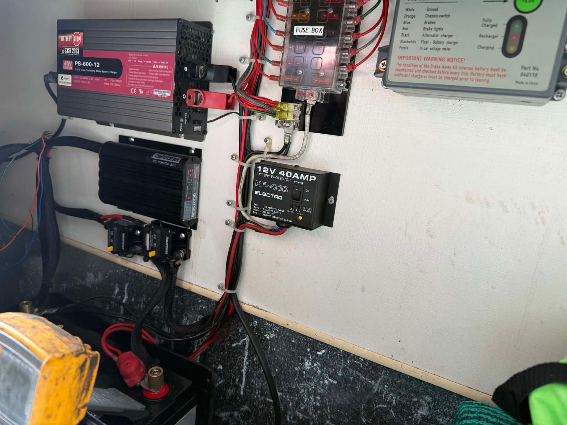 A Wall-mounted Electrical Setup Featuring An Inverter — Elite Fleet Auto - Electrics & Mechanical in Cannonvale, QLD