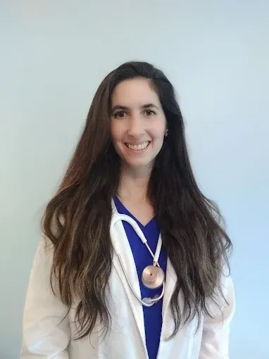 Meet our top integrative, holistic doctor in Westminster, MD. Dr. Brianna Livesay Thayakaran Headshot with lab coat on | top asian medicine practice in Westminster, MD.