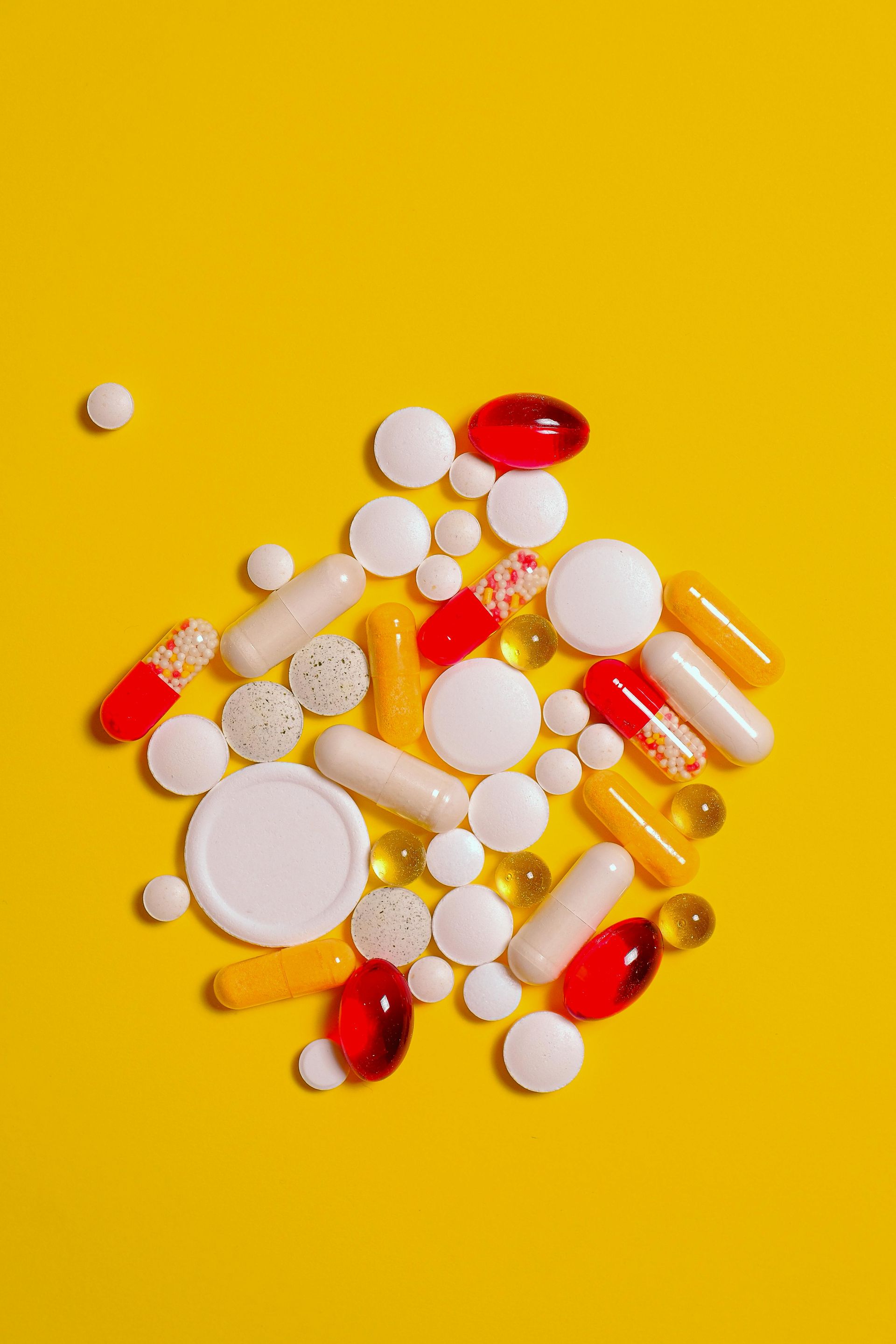 A picture of holistic Chinese medicine supplements to buy on bright yellow background