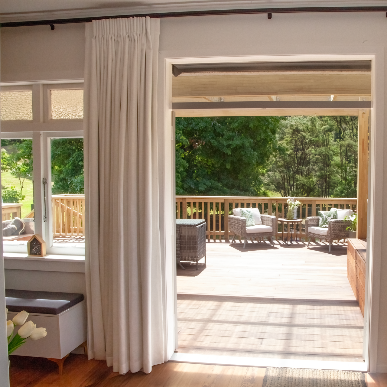Interior view of a guest house with a deck. Accommodation at Makarau Auckland.