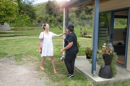 Dana Murphy greets client at Enhance Health and Wellness Retreat's beauty spa Makarau Rodney 