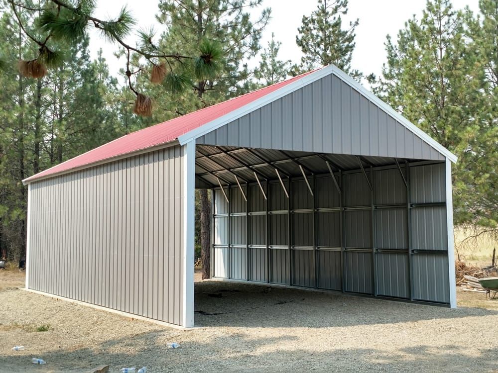 A large metal building with a red roof