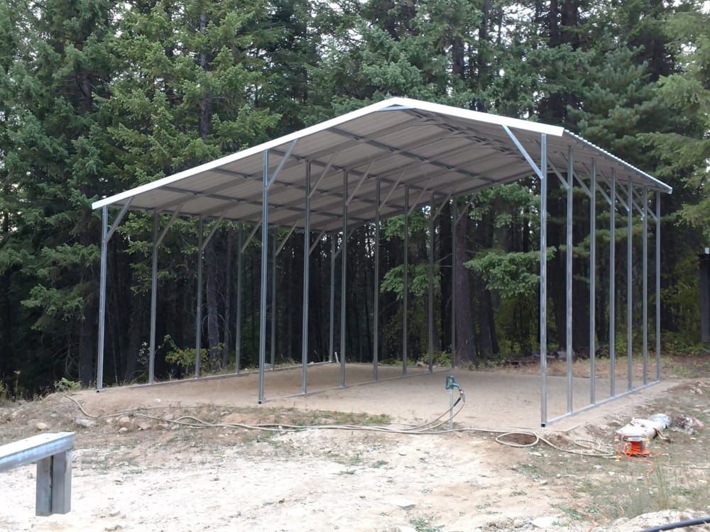 A large metal structure in the middle of a forest