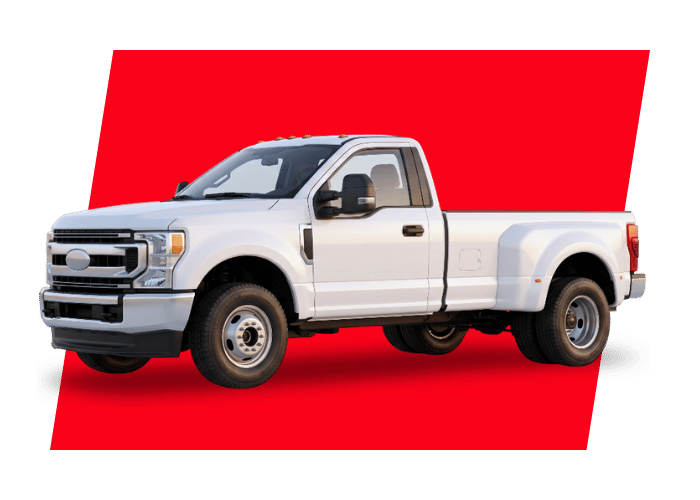 White heavy duty pickup truck with dual rear wheels displayed on a clean background for commercial work applications.