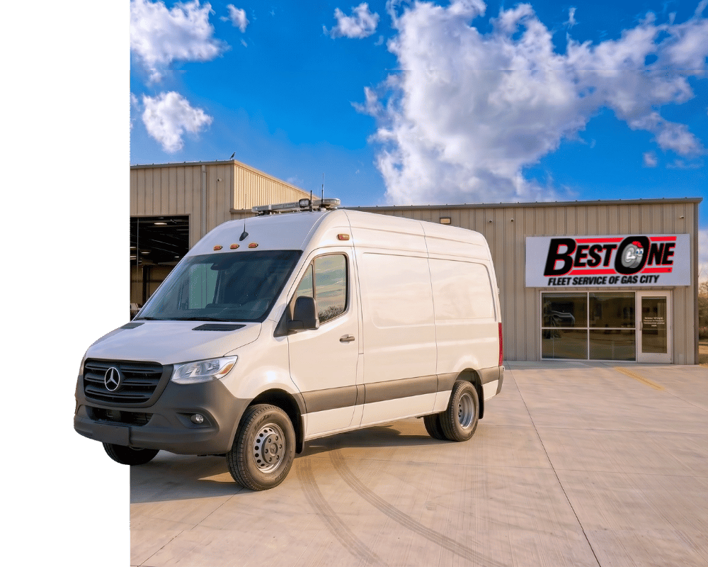 White Mercedes cargo van parked outside Best One Fleet Service of Gas City shop under a blue sky.