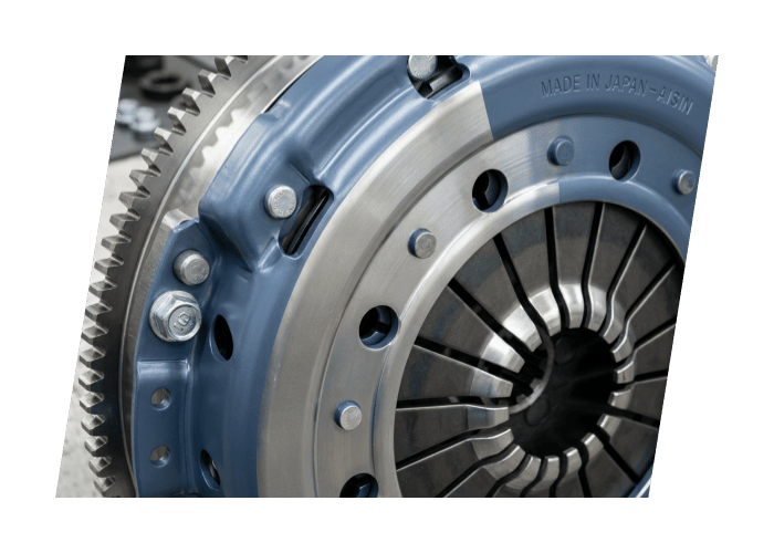 Close up of a heavy duty flywheel and clutch assembly showing precision machined components.