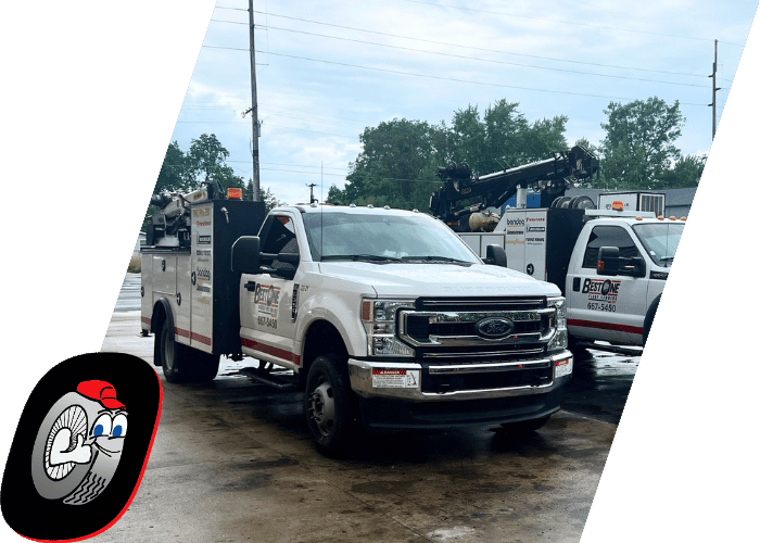White utility service truck equipped for on site commercial vehicle repairs.