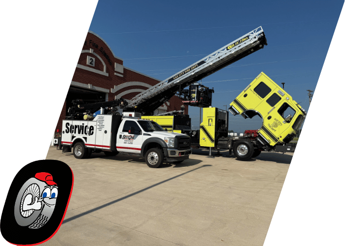 Utility service truck assisting with maintenance on a raised hi rail vehicle.