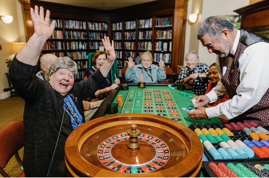 A group of people are playing a game of roulette
