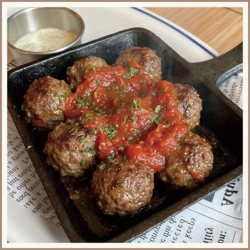 Lamb Meatballs in a cast-iron skillet.