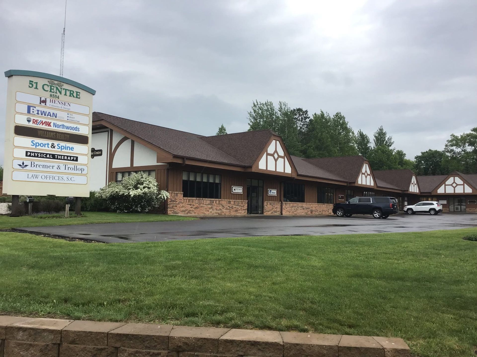 Lakeland Roofing family-owned crew at a completed residential roofing project in Minocqua, WI.