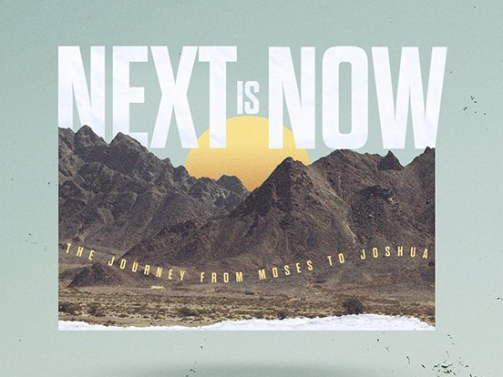 A poster that says next is now with mountains in the background