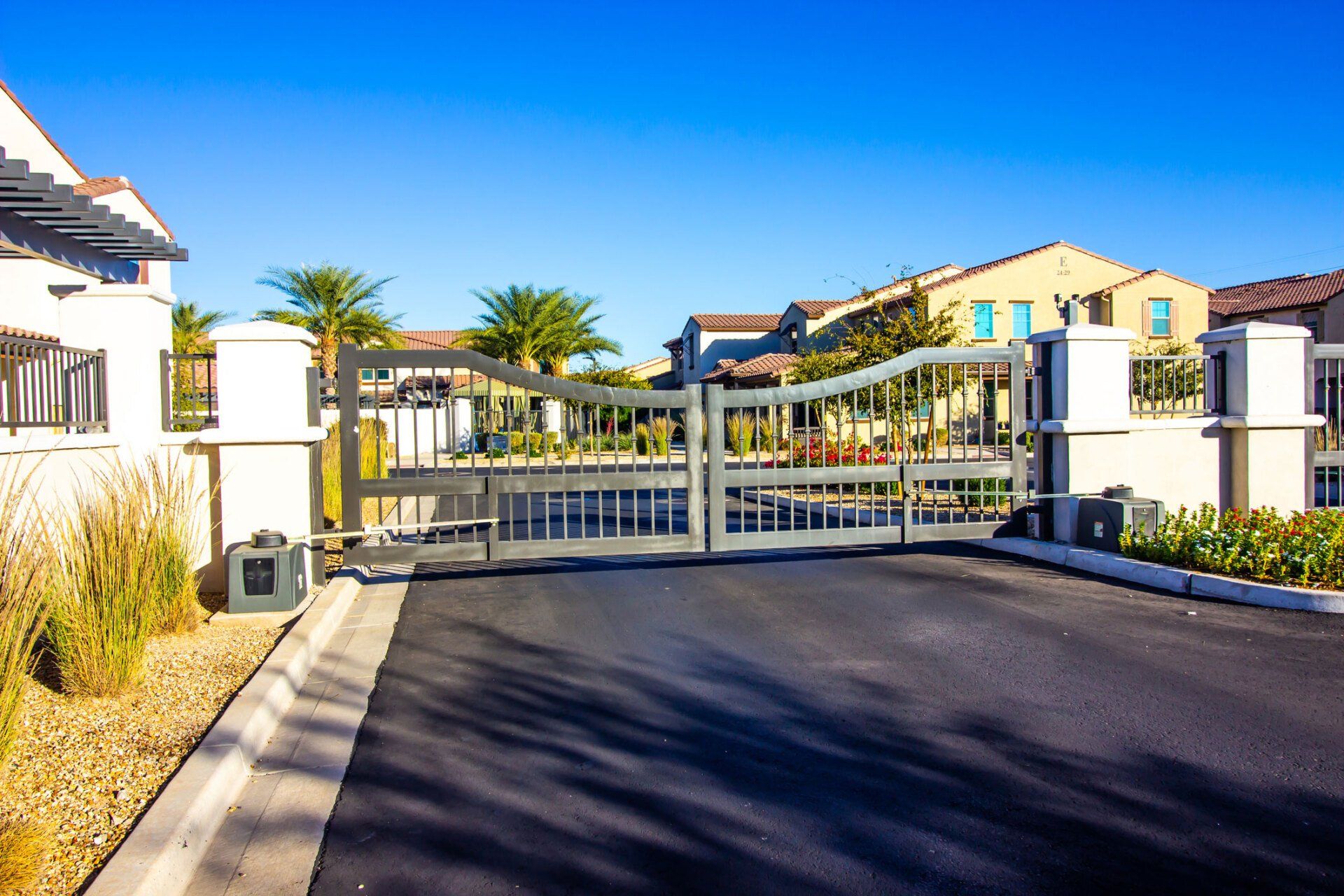 Black Metal Gates with a Field of Green Grass — Sydney, NSW — Australian Gate Centre
