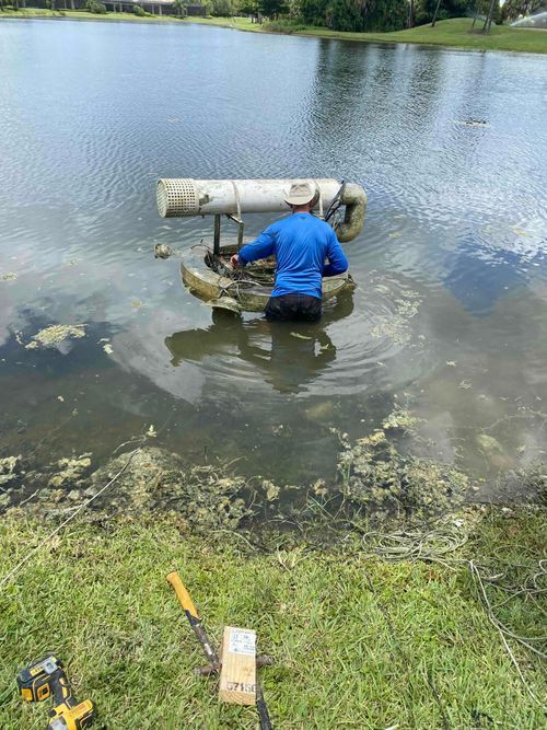 Professional installation of a fountain in a lake.