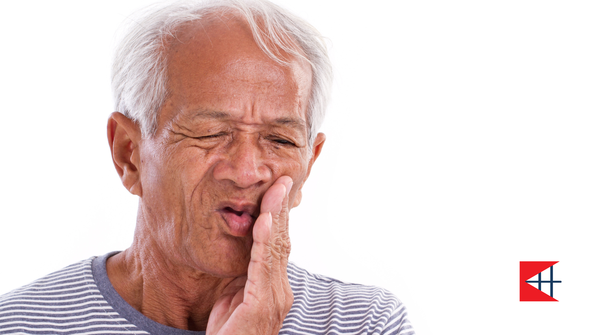 Man holding jaw, grimacing in pain.