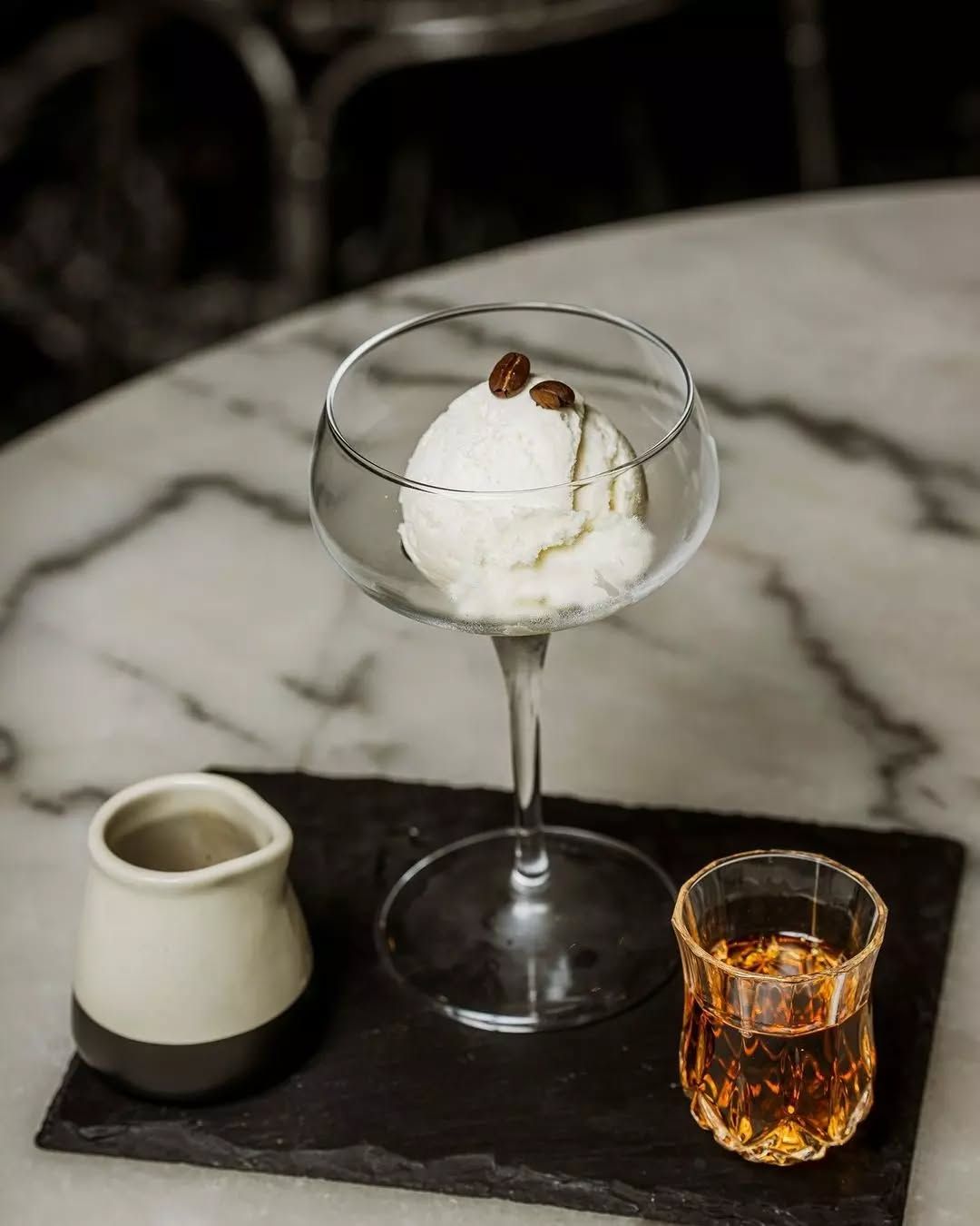 A Glass Of Ice Cream And A Shot Glass On A Table — Springs Cleaning Supplies In Ciccone, NT