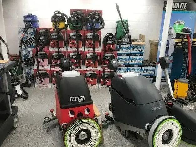 Two Cleaning Machines Are Sitting In A Room — Springs Cleaning Supplies In Ciccone, NT