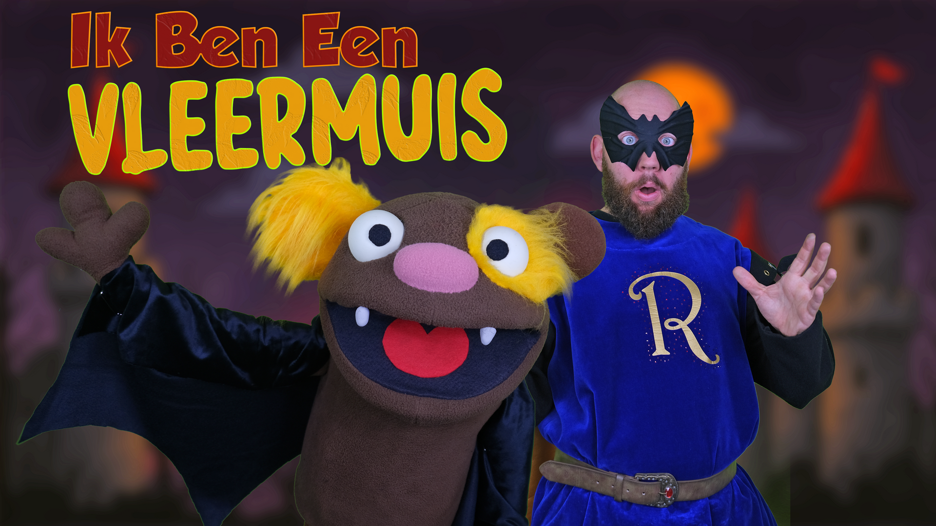 A man in a mask and puppet dressed as a bat. Text reads: 