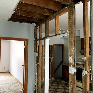 A room that is being remodeled with wooden beams