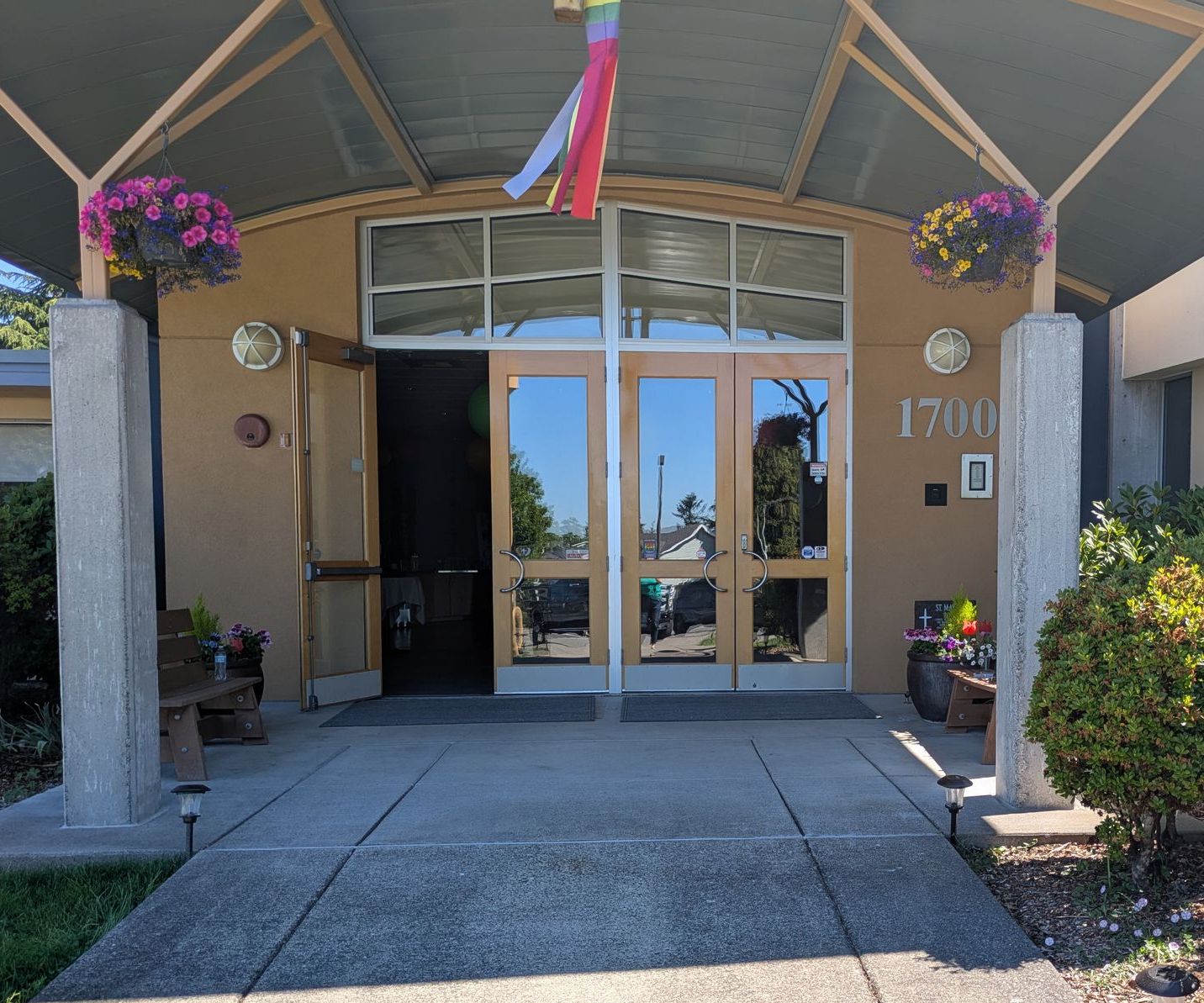 The entrance of the church with a door propped open.