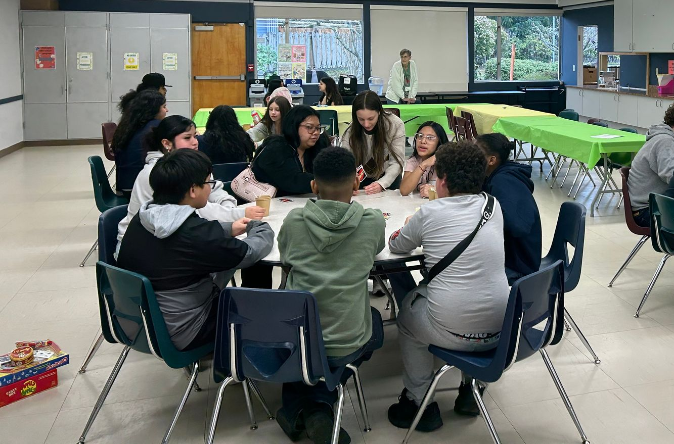 Students sharing a meal during the after-school program at St. Matthew’s Lutheran Church in Renton.