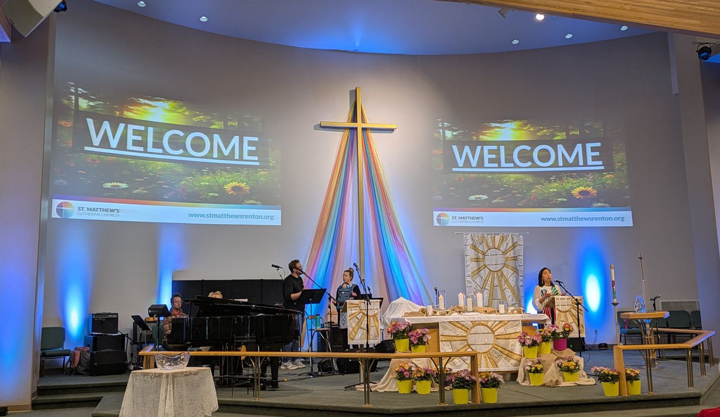 Sanctuary at St. Matthew’s Lutheran Church in Renton with rainbow fabric around the cross.