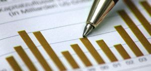 A pen is pointing at a graph on a piece of paper.