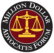 The logo for the million dollar advocates forum is a scale of justice in a circle.