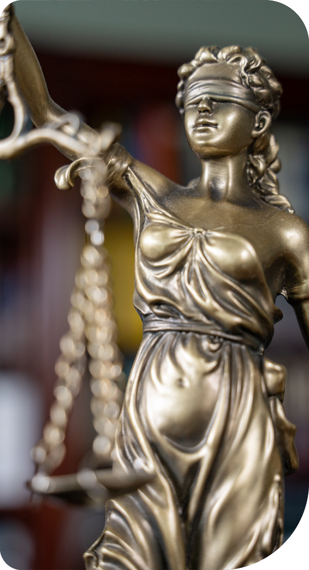 A statue of a woman holding a scale of justice.