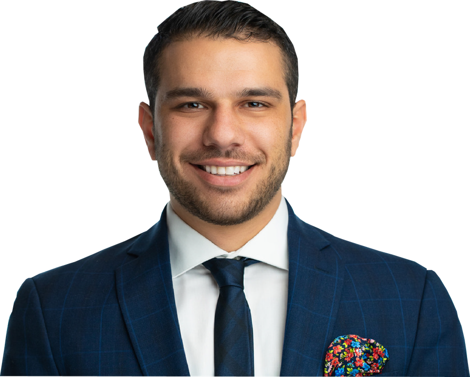 A man in a suit and tie is smiling for the camera.