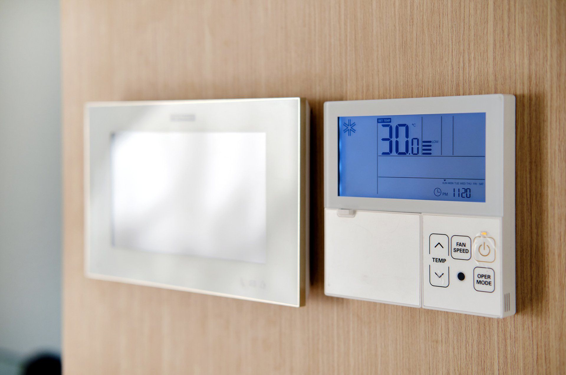 Wall-mounted thermostat.