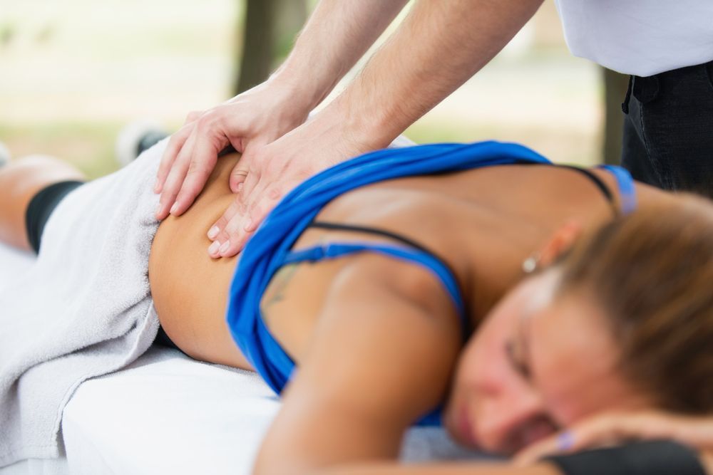 Person Receiving a Back Massage on a Massage Table Outdoors — A1 Coffs Harbour in Coffs Harbour, NSW