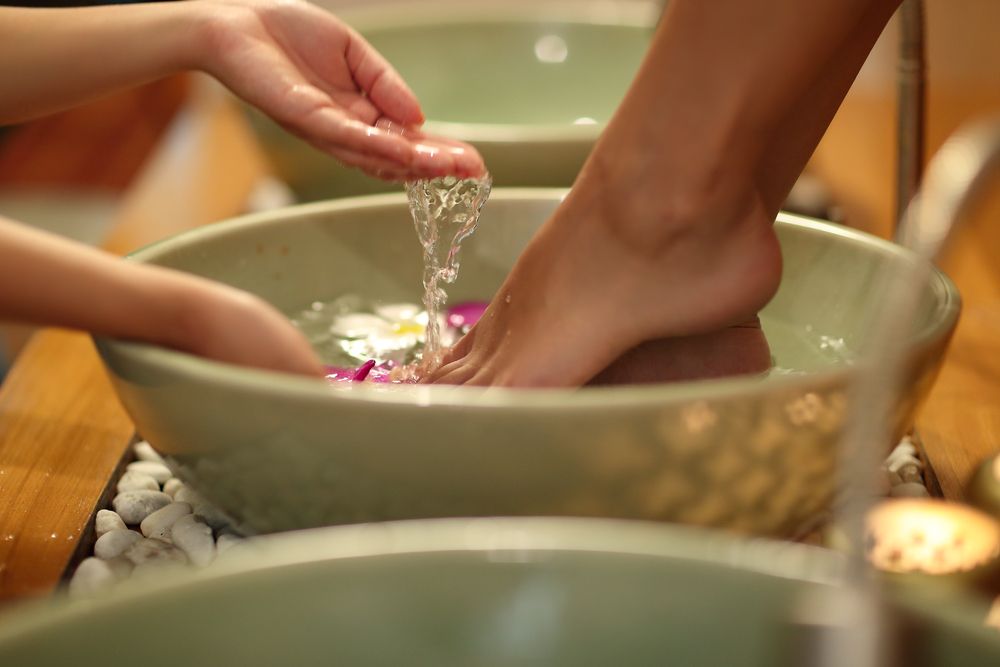 Person's Foot Soaking in a Bowl of Water, Hand Pouring More Water — A1 Coffs Harbour in Coffs Harbour, NSW