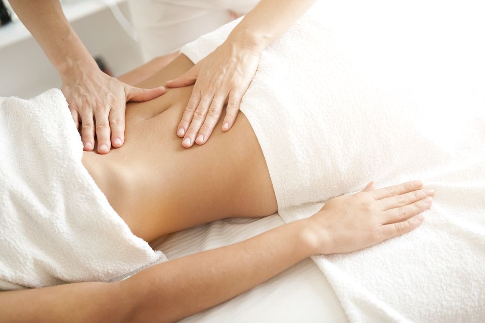 Hands Massaging a Person's Abdomen — A1 Coffs Harbour in Coffs Harbour, NSW