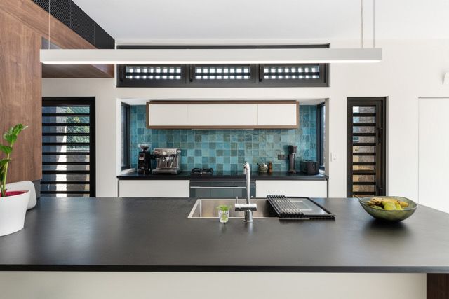 A Kitchen With A Large Island In The Middle Of It — Concept Design Kitchens & Joinery In Hawks Nest, NSW