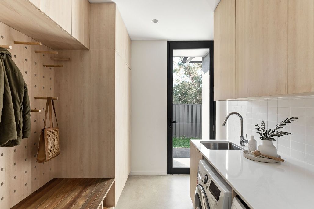 A Laundry Room With Wooden Cabinets — Concept Design Kitchens & Joinery In Hawks Nest, NSW