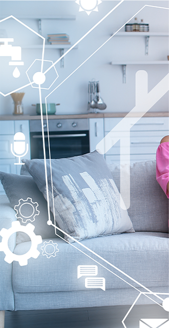 a woman in a pink shirt is sitting on a couch in a living room .