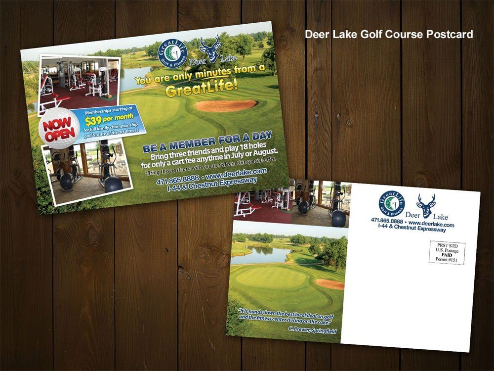 a deer lake golf course postcard is sitting on a wooden table .