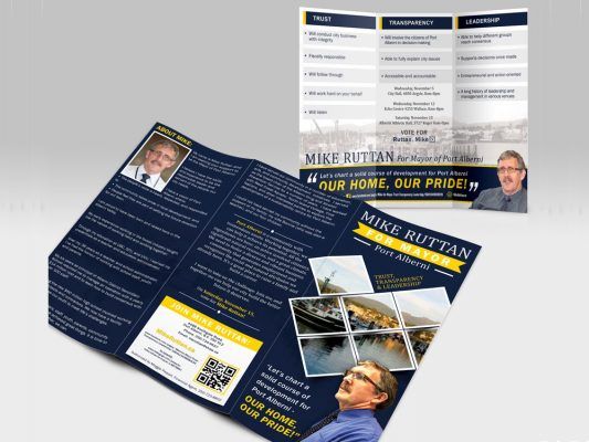 a brochure for mike ruttan is sitting on a table .