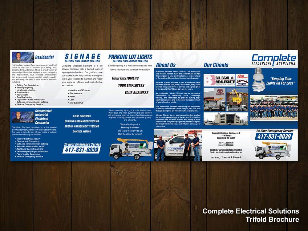 a complete electrical solutions trifold brochure on a wooden table