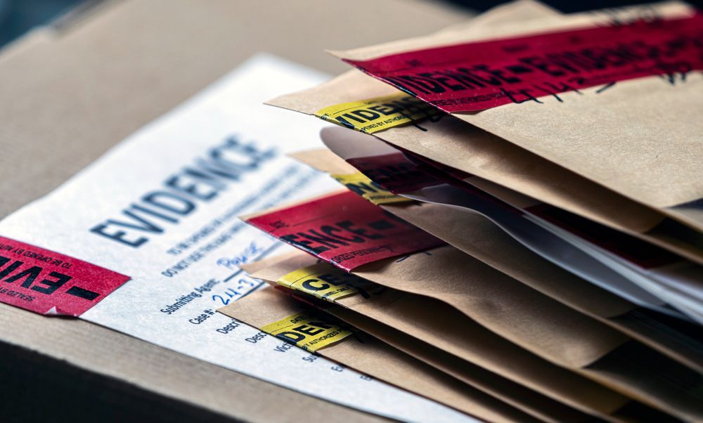 A stack of brown envelopes sealed with red and yellow