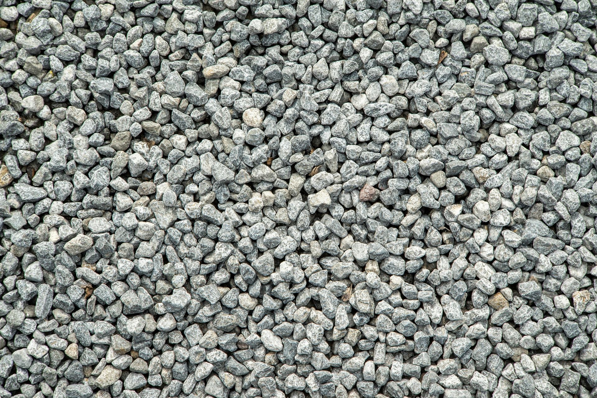A pile of gravel is sitting on the ground.