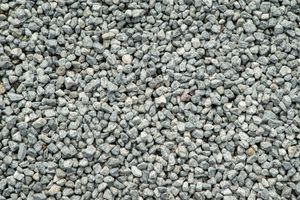 A pile of gravel is sitting on the ground.