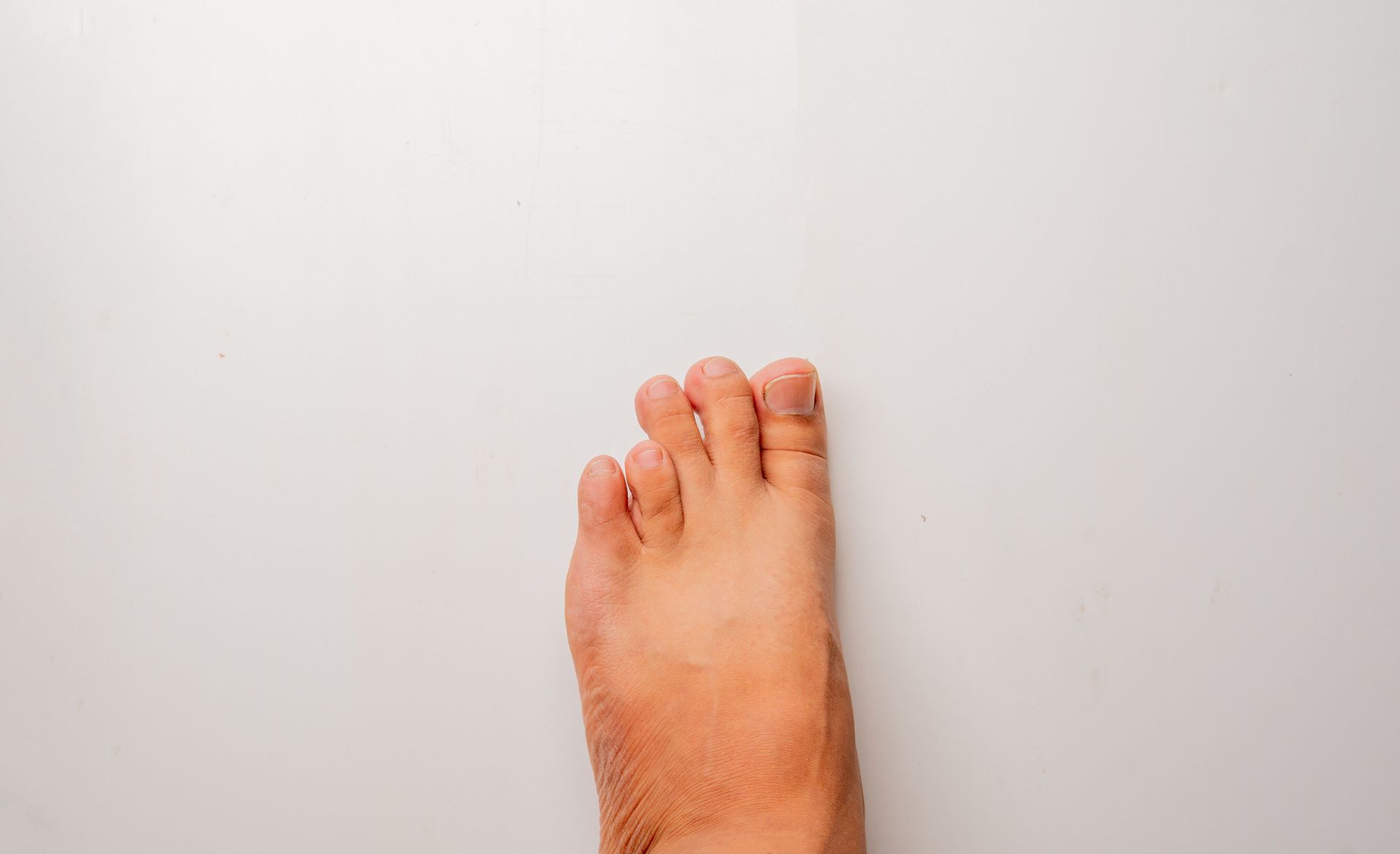 Bare foot on white background.