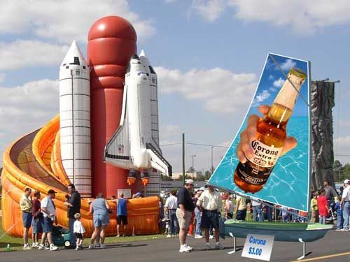 A large inflatable space shuttle and a bottle of corona beer