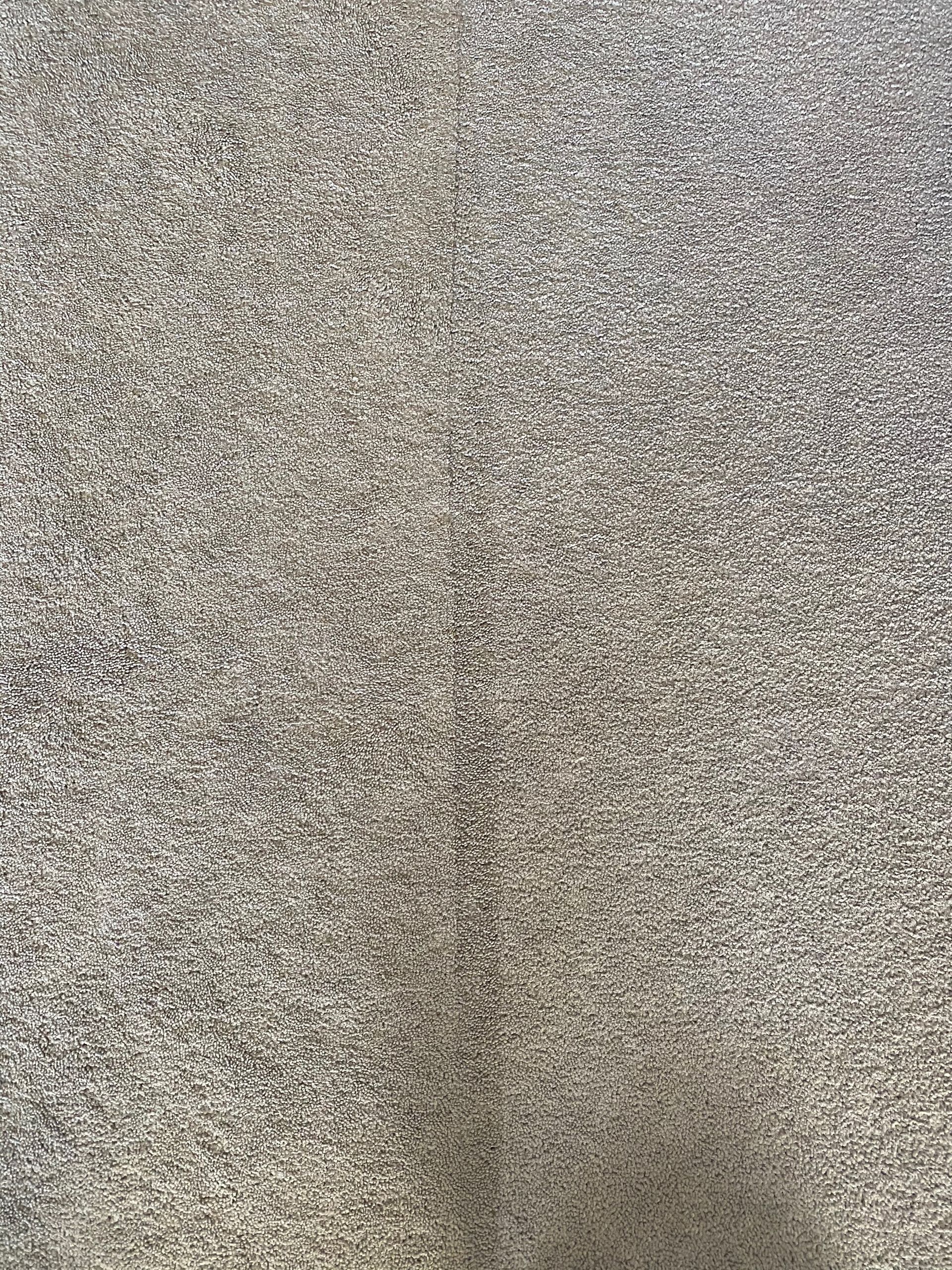 A close up of a gray carpet texture.