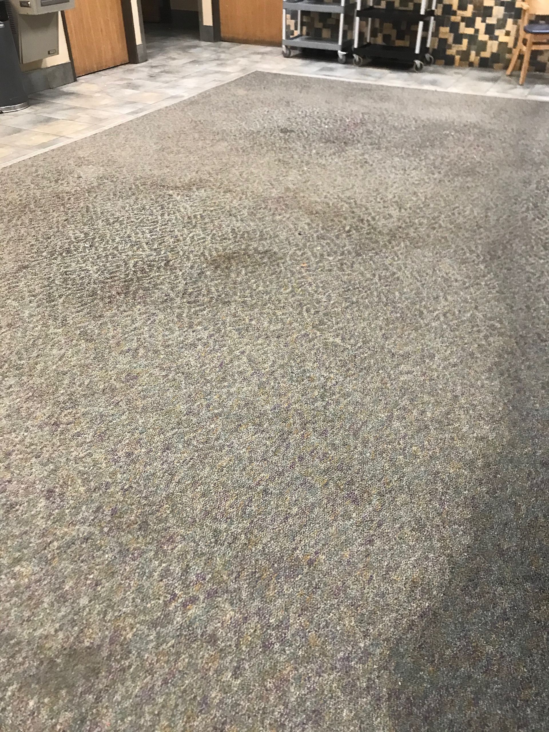 A concrete floor with a lot of small rocks on it.