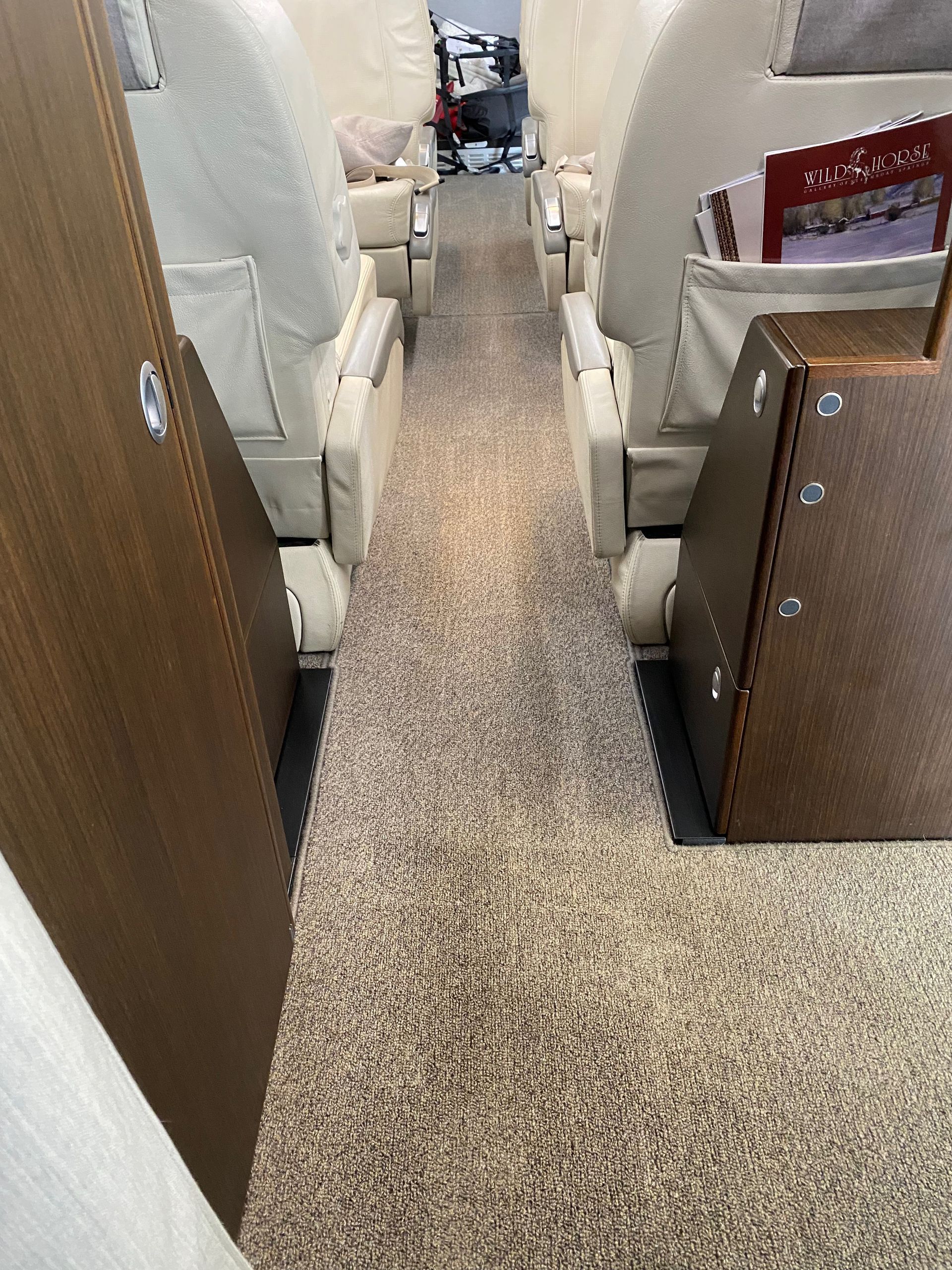 The inside of a plane with a carpeted floor