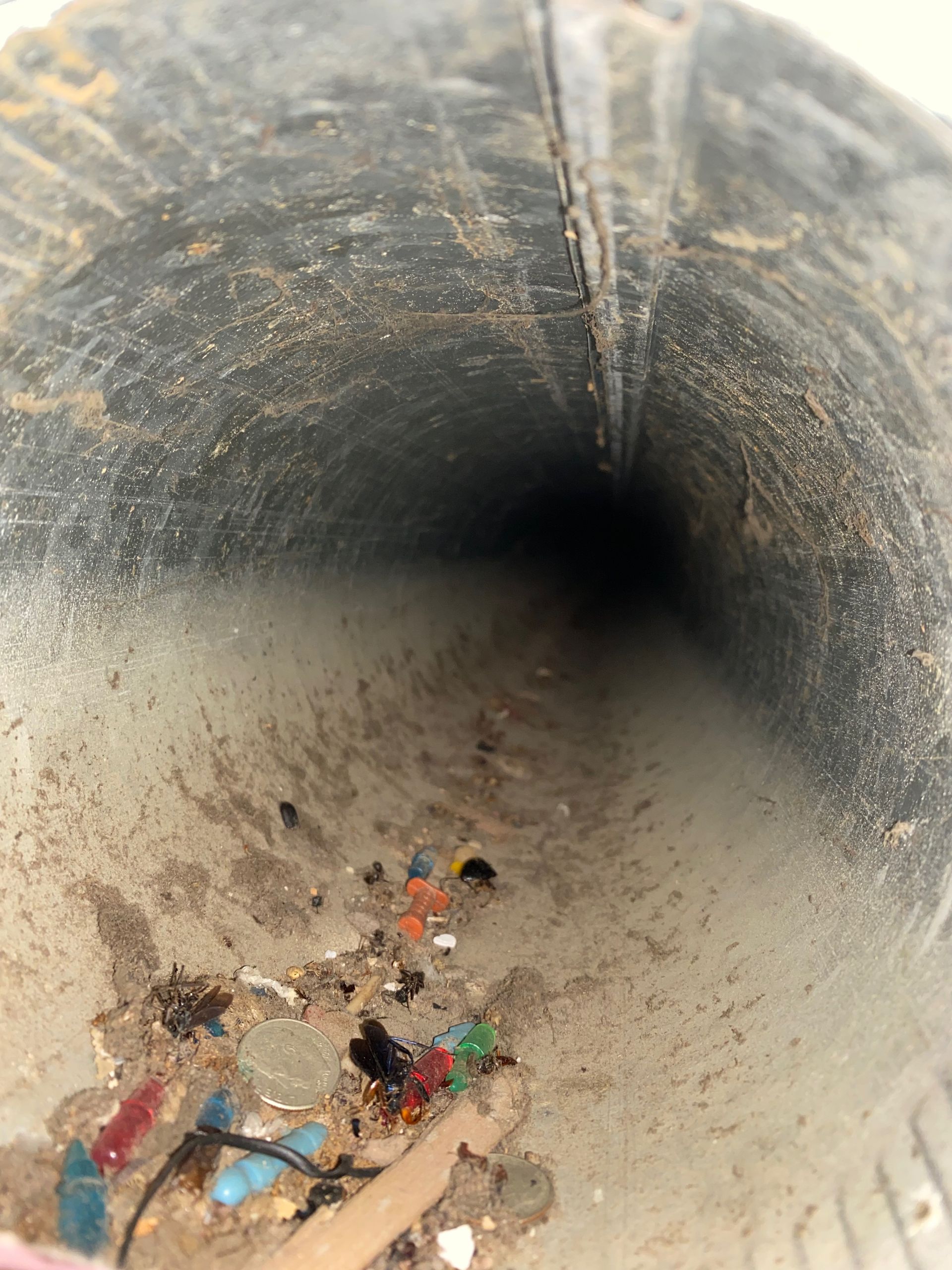 A dirty tunnel with a lot of trash in it
