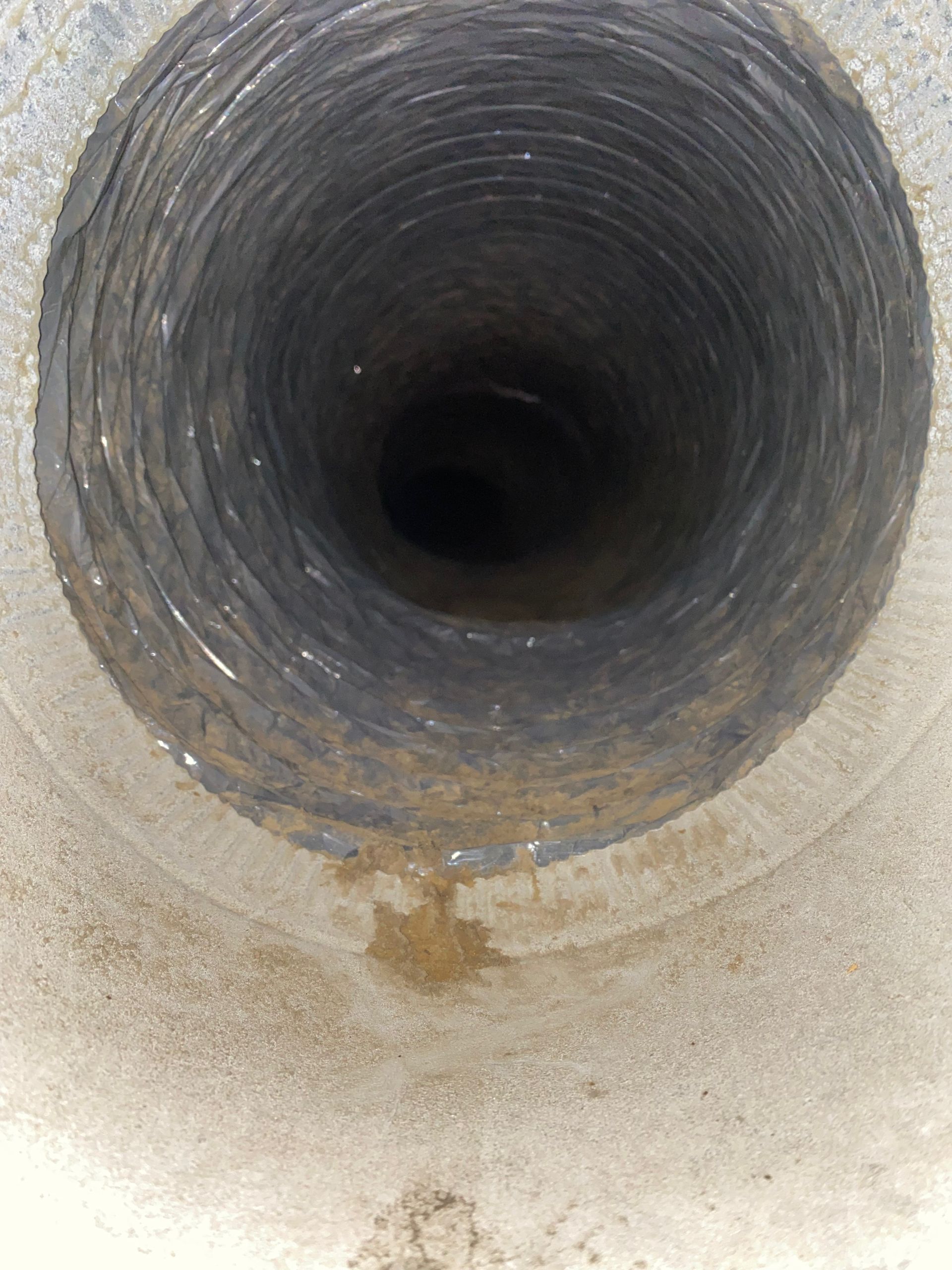 A close up of a hole in a pipe